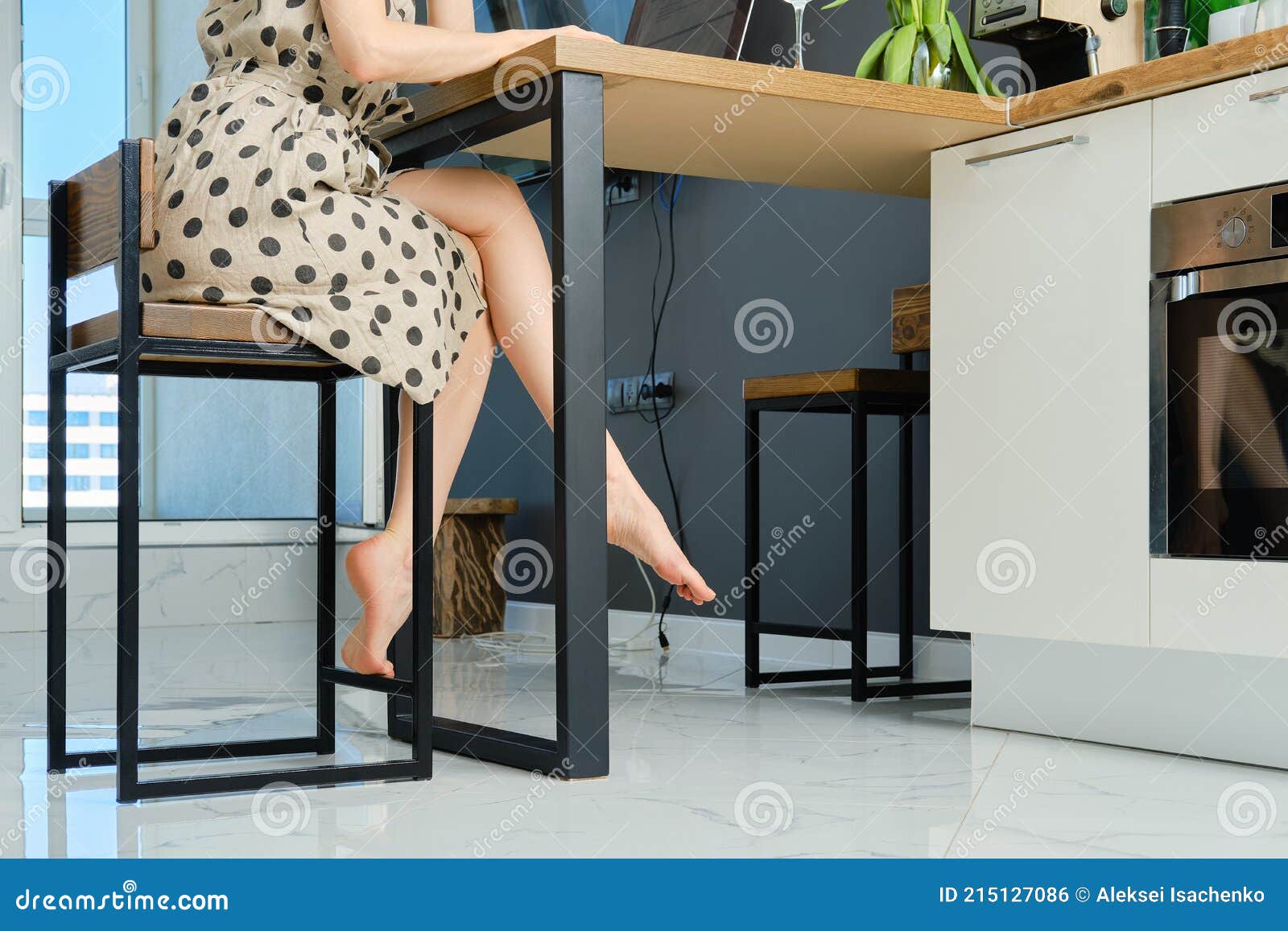 Her hot legs under the restaurant table