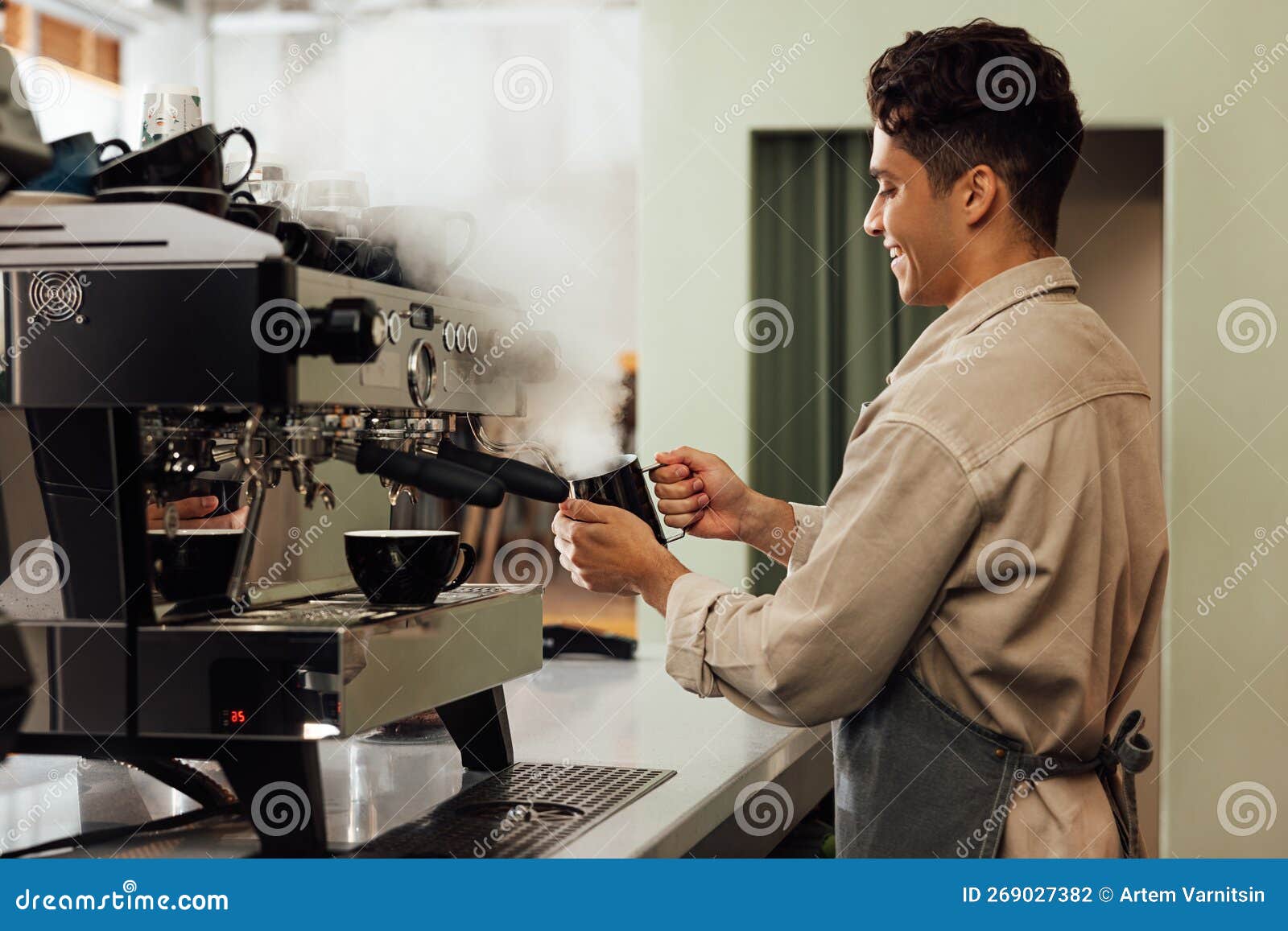 Side View of a Barista Using a Coffee Machine. Coffee Shop Owner