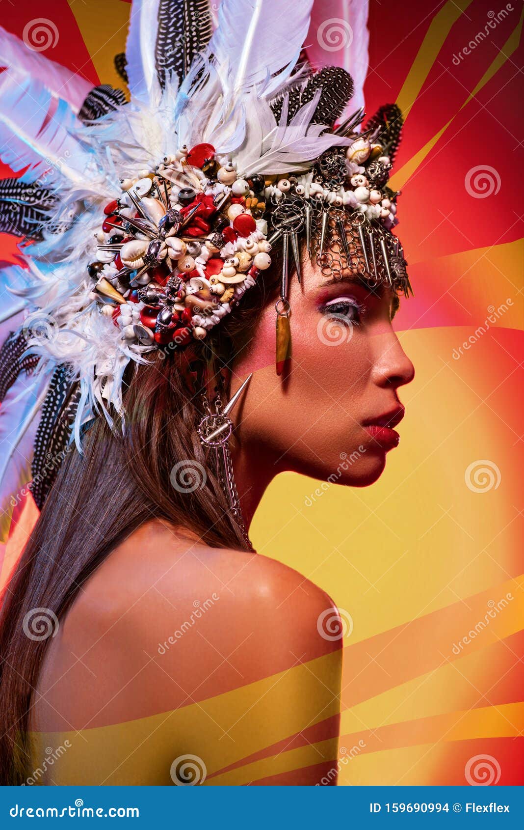 side view of beautiful naked woman in tribal headdress