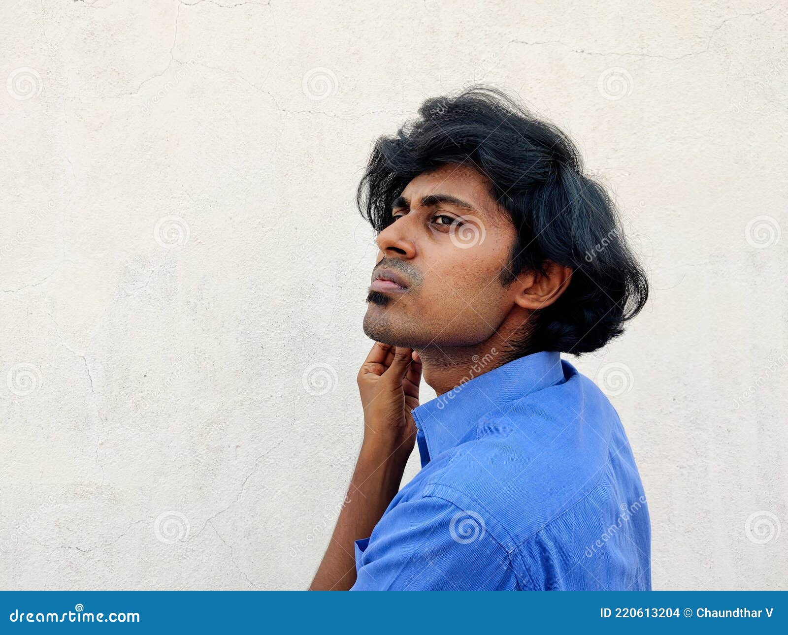 Causal Looking Clean Shaved Young South Indian Man. White Background