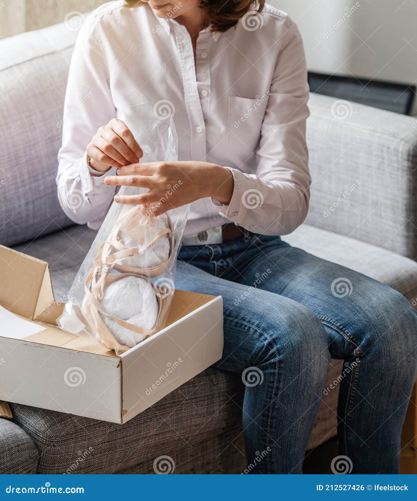 Side View of Curious Woman Unboxing Full-cup Bra from a Cardboard Box Stock  Photo - Image of music, boutique: 212527426