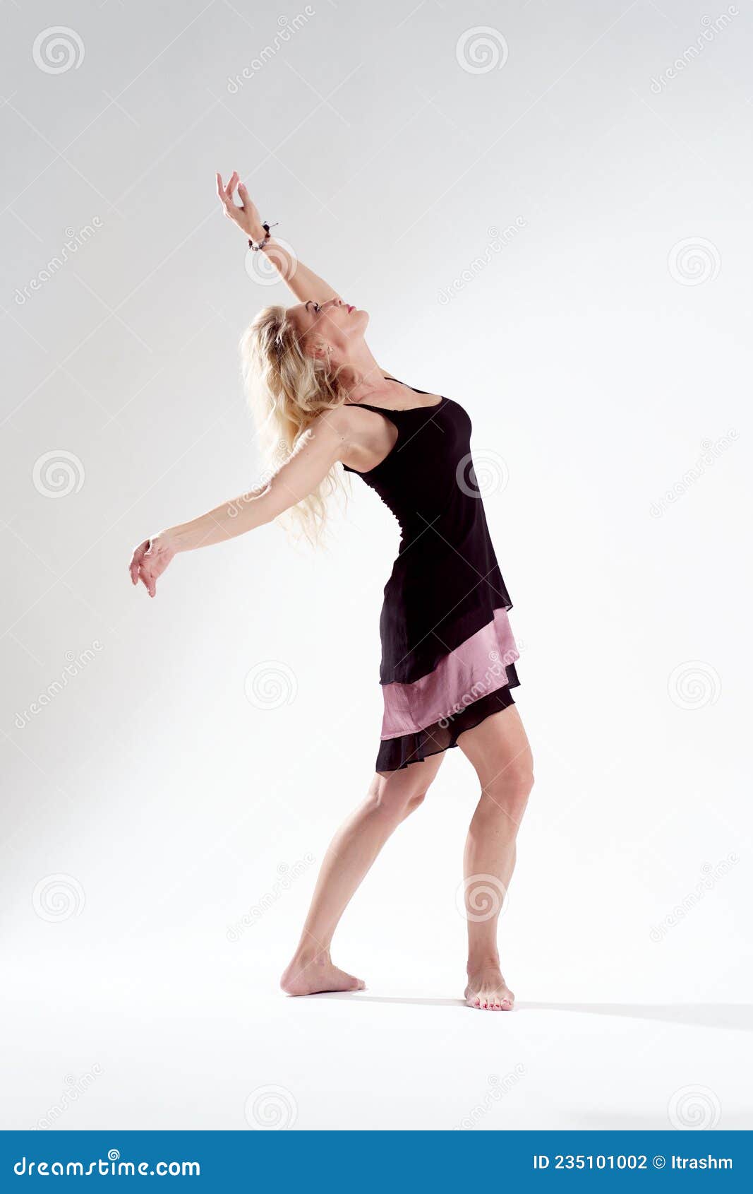 Side View of Deflected Back Blonde Dancing in Empty Studio Stock Photo ...