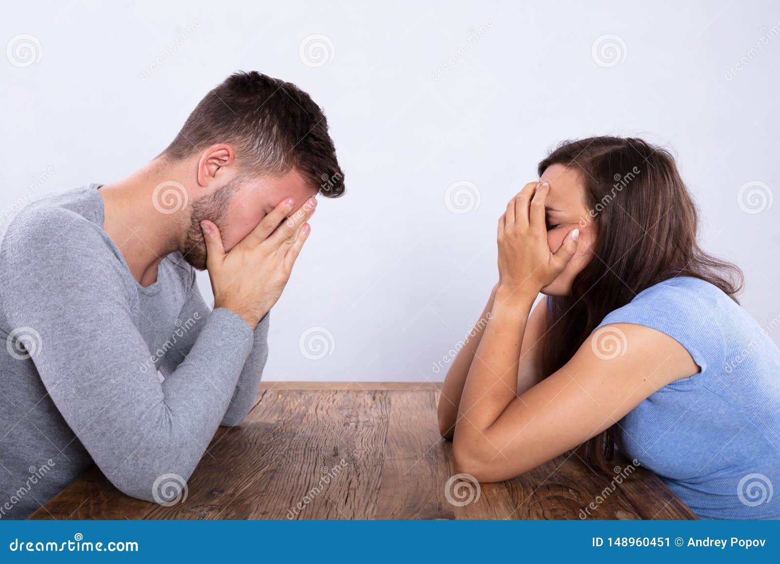 Depressed Couple Sitting Opposite Each Other Stock Image Image Of