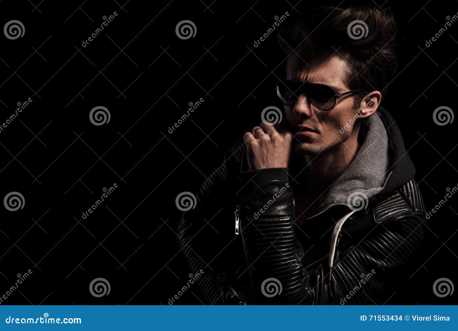 Side View of a Dramatic Man in Leather Jacket and Sunglasses Stock ...