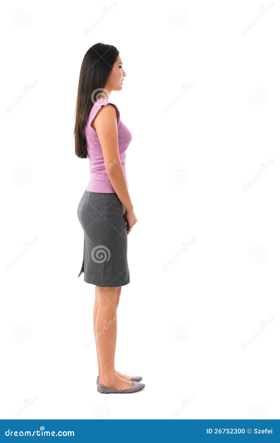 Photo about Side view full body of Asian female in office attire standing o...