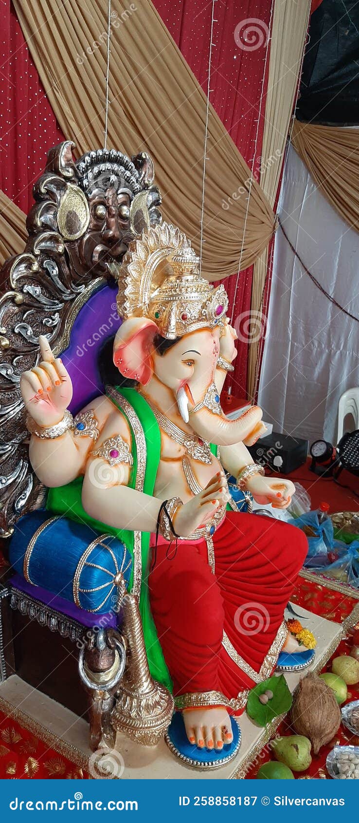 Side View Of Ganesha Idol During Ganesh Chaturthi Festival India Stock side-view-of-ganesha-idol-during-ganesh-chaturthi-festival-india-stock