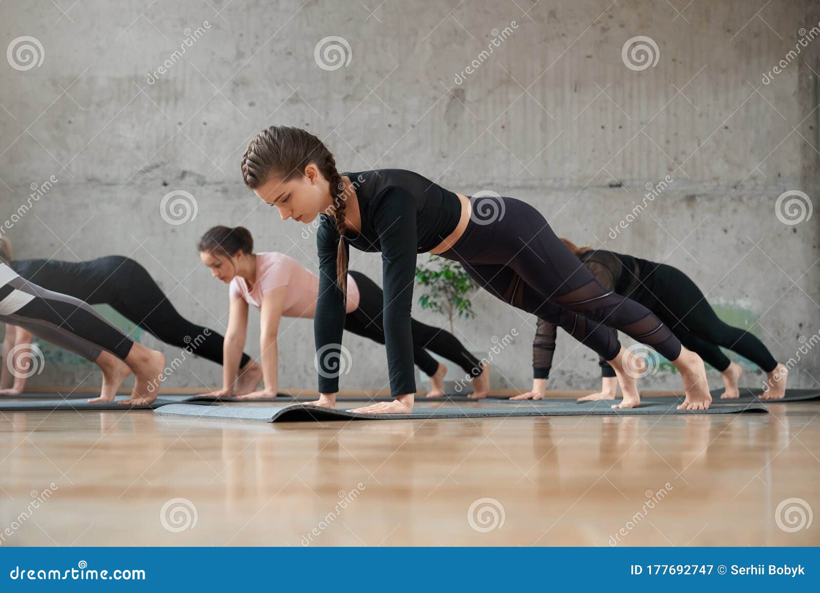 Group of Women Doing Plank Exercice in Hall. Stock Image - Image of ...