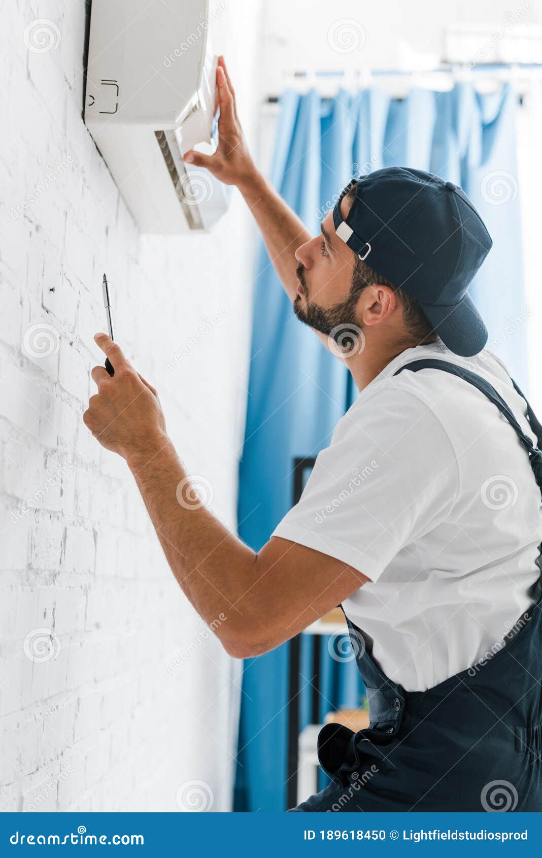 View of Handyman Fixing Air Conditioner Stock Photo Image of