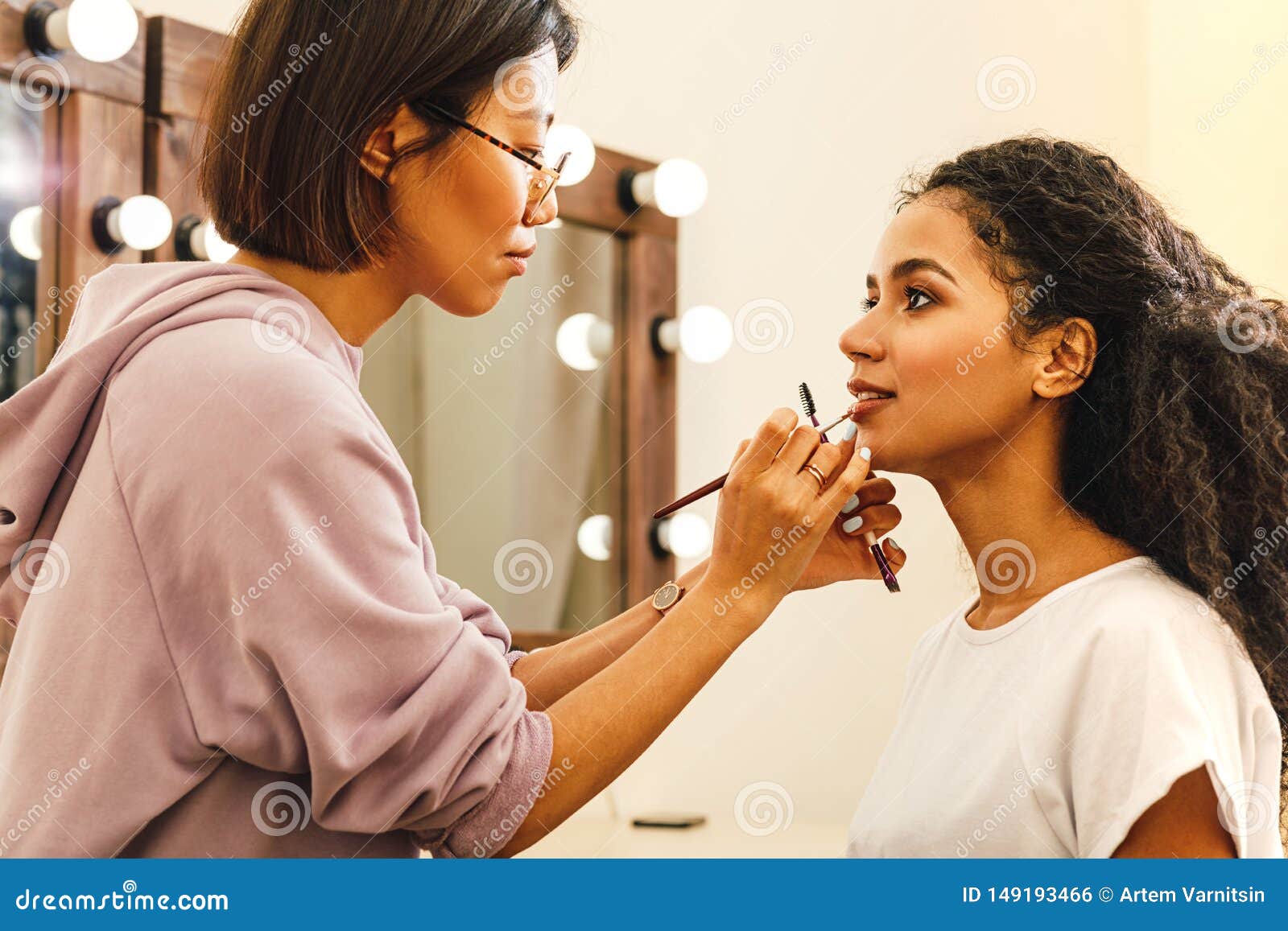 Side View of a Makeup Artist Applying Lip Paint Stock Photo Image of