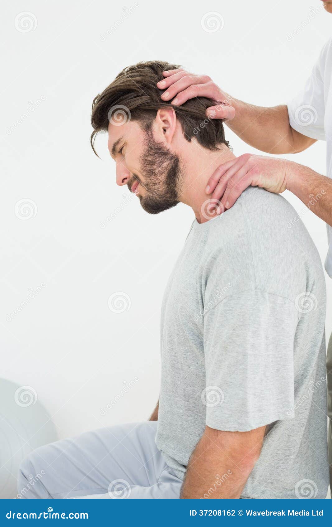 Side View of a Man Getting the Neck Adjustment Done Stock Photo Image
