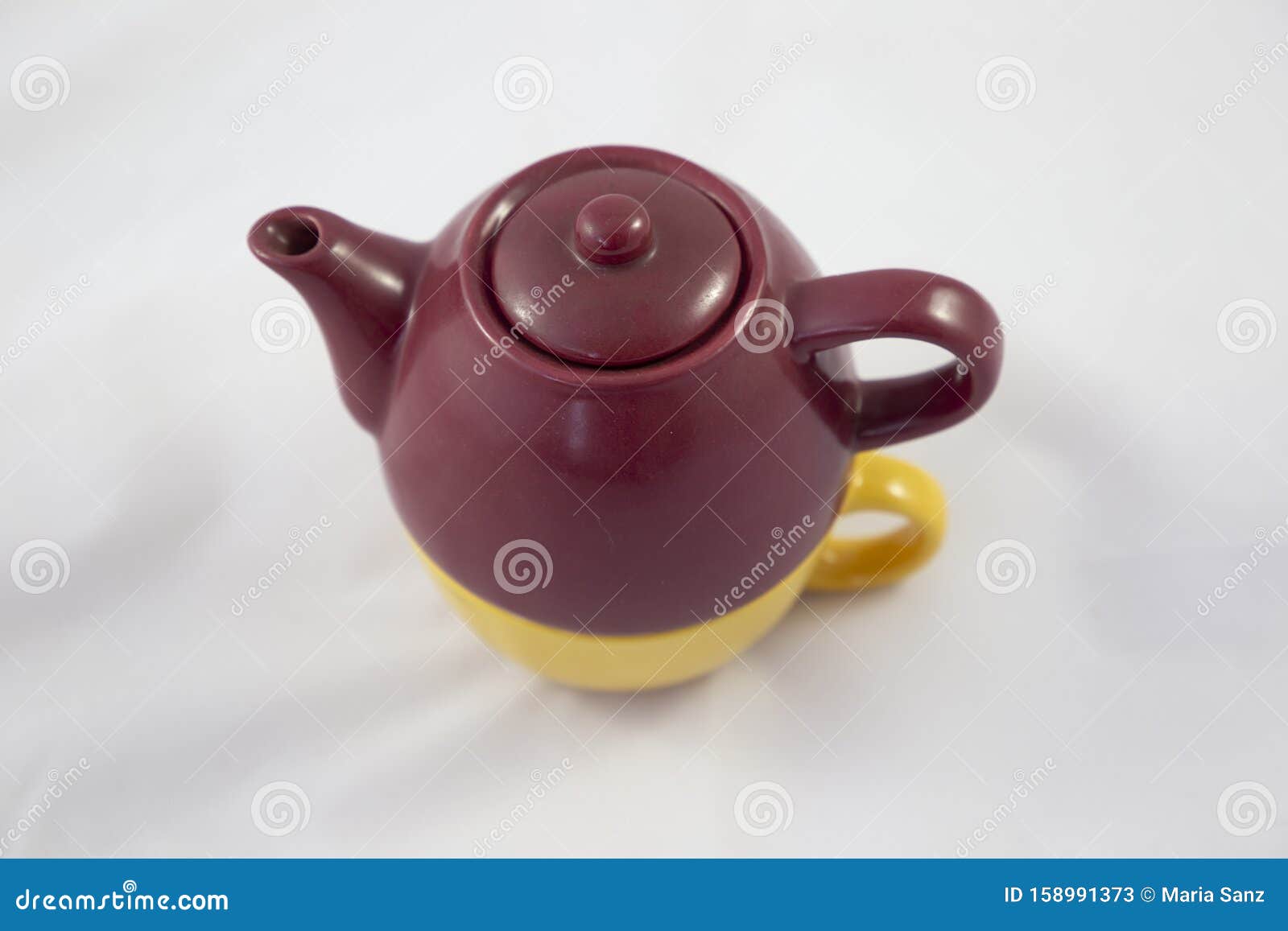 bicolor ceramic teapot on white background.