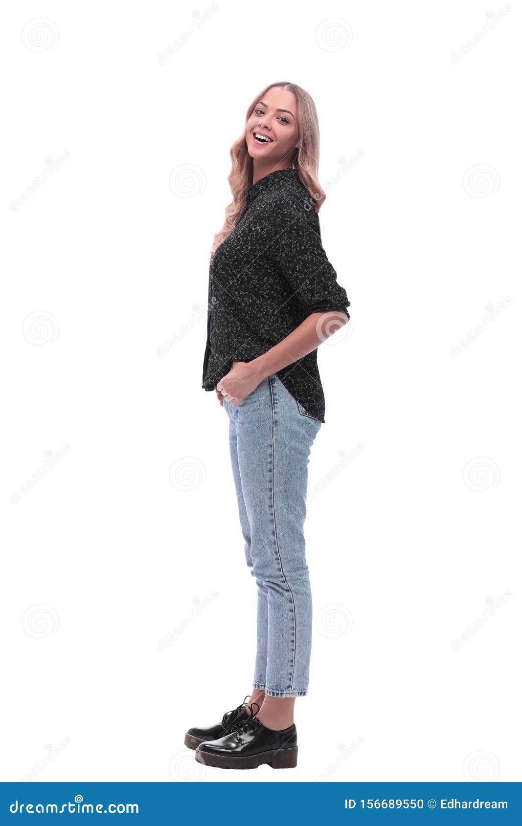 Side View. Modern Young Woman in Jeans and Black Blouse Stock Photo ...
