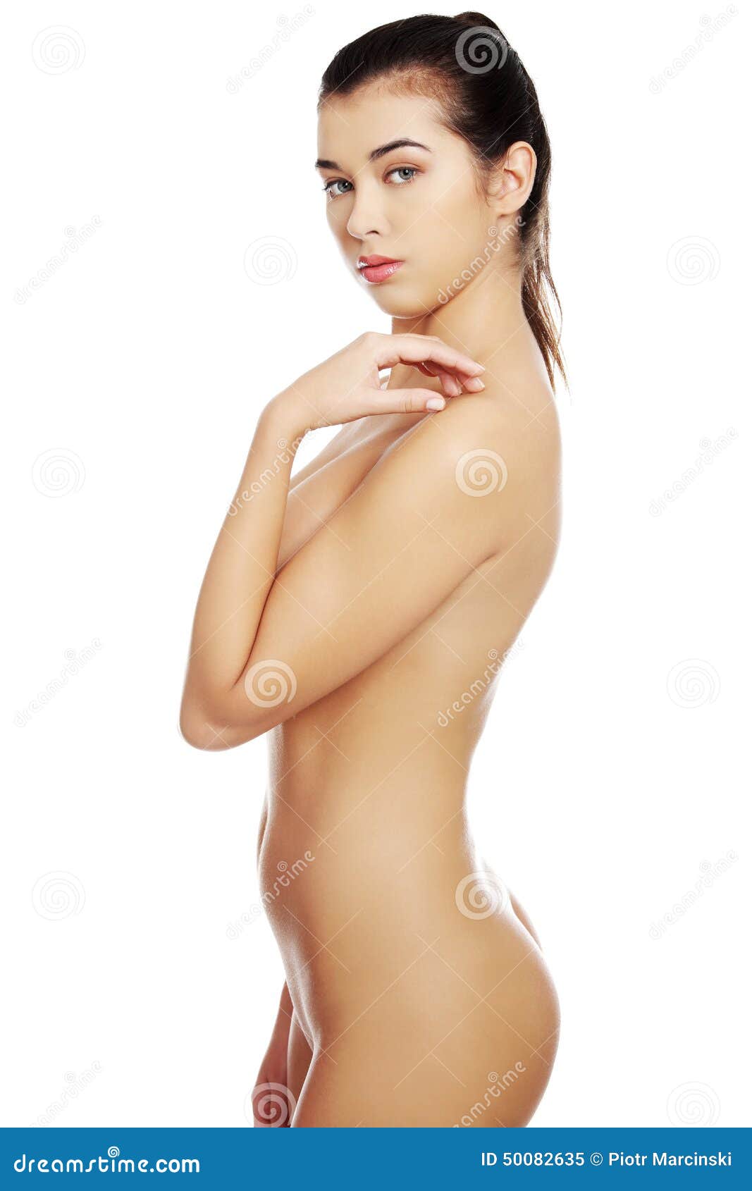 Side view of nude woman posing to the camera. 