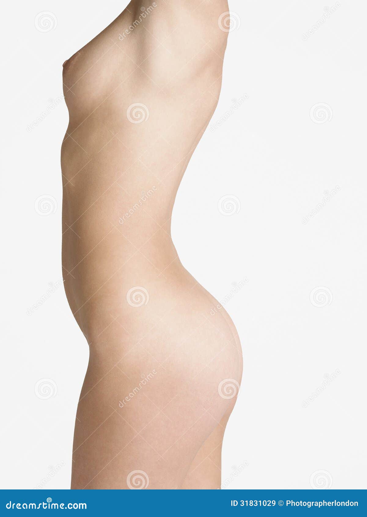 Photo about Midsection of a nude young woman standing against white backgro...