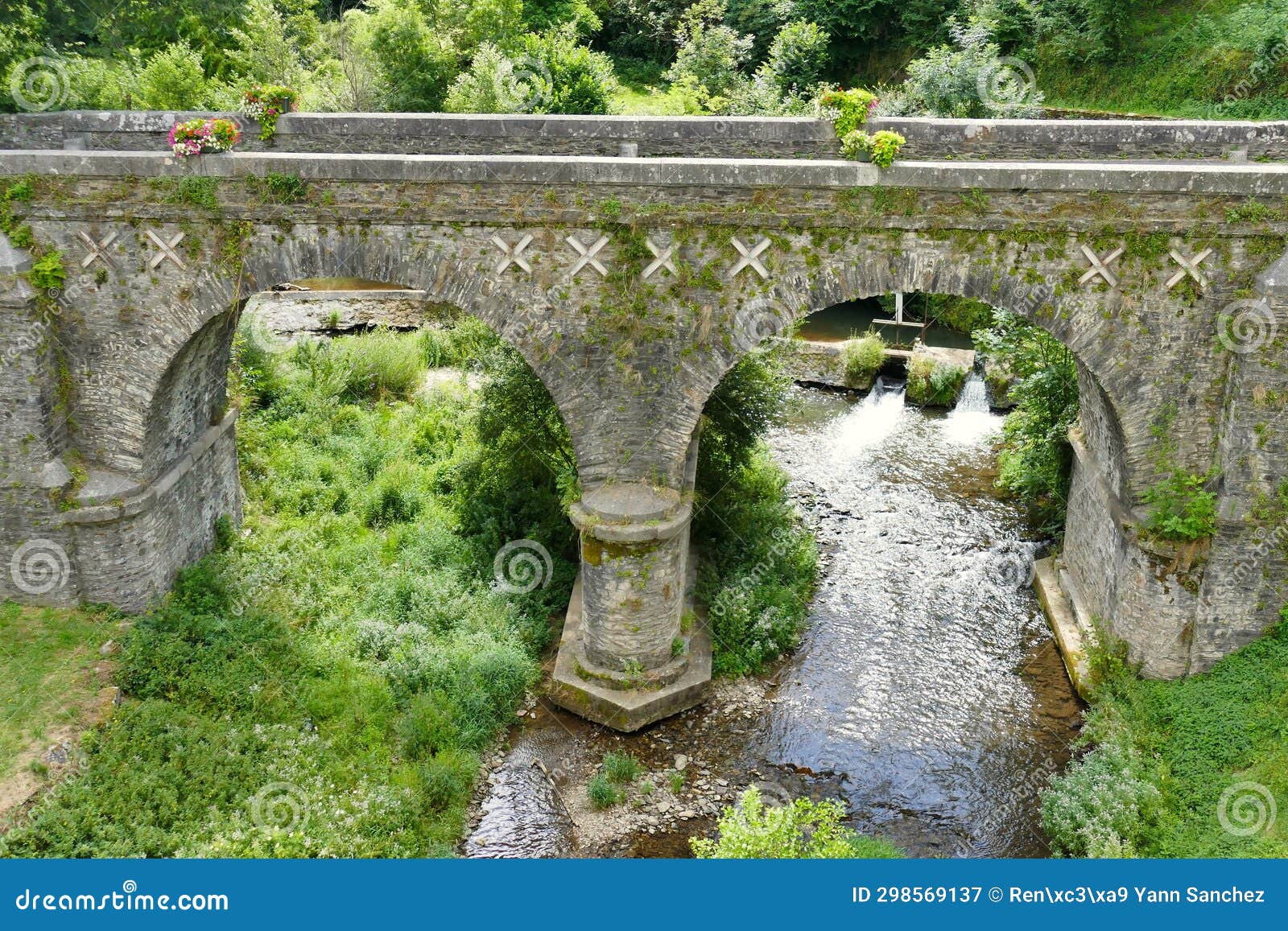 the old bridge over the gijou river in the village of lacaze