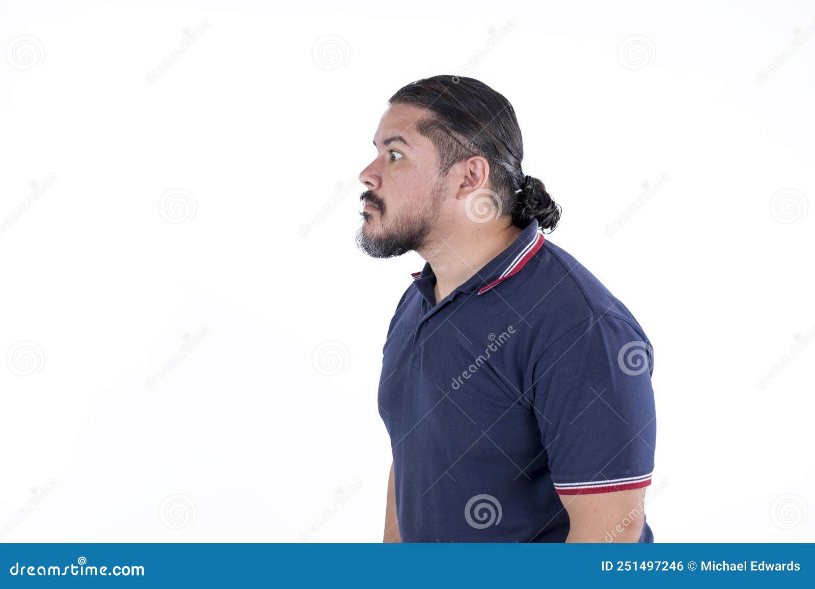 side view of a perplexed man in his late 30s transfixed, staring in disbelief. in a state of incredulity. riveted or hypnotized.