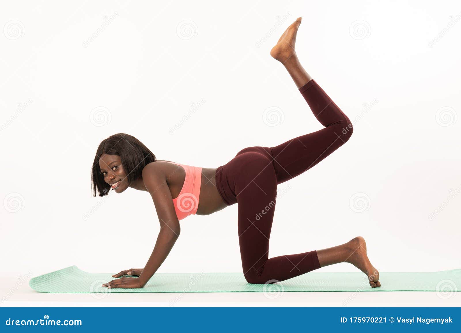 Side View Photo of a Slim African Girl in Sportswear Who Doing Yoga  Exercises on Yoga Mat, Looking at the Camera Stock Image - Image of girl,  healthy: 175970221