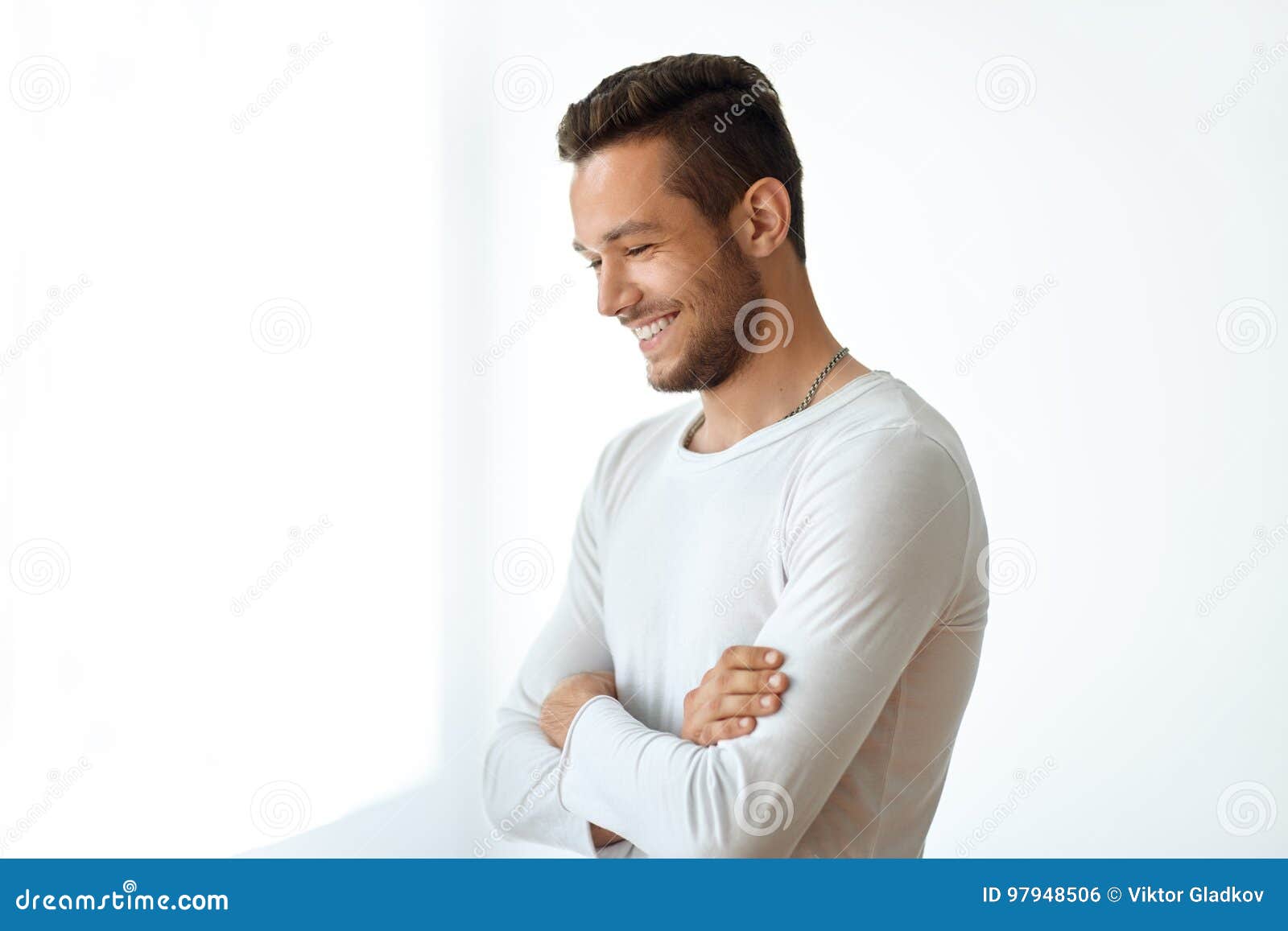 side view portrait of smiling handsome man on white background