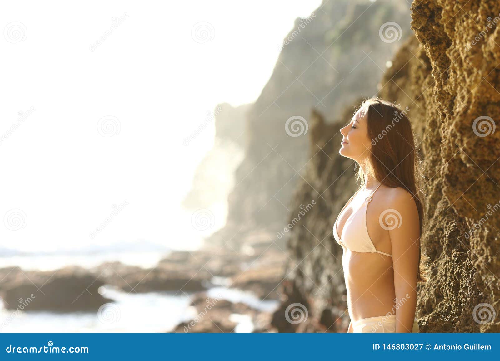 sunbather breathing fresh air on the beach