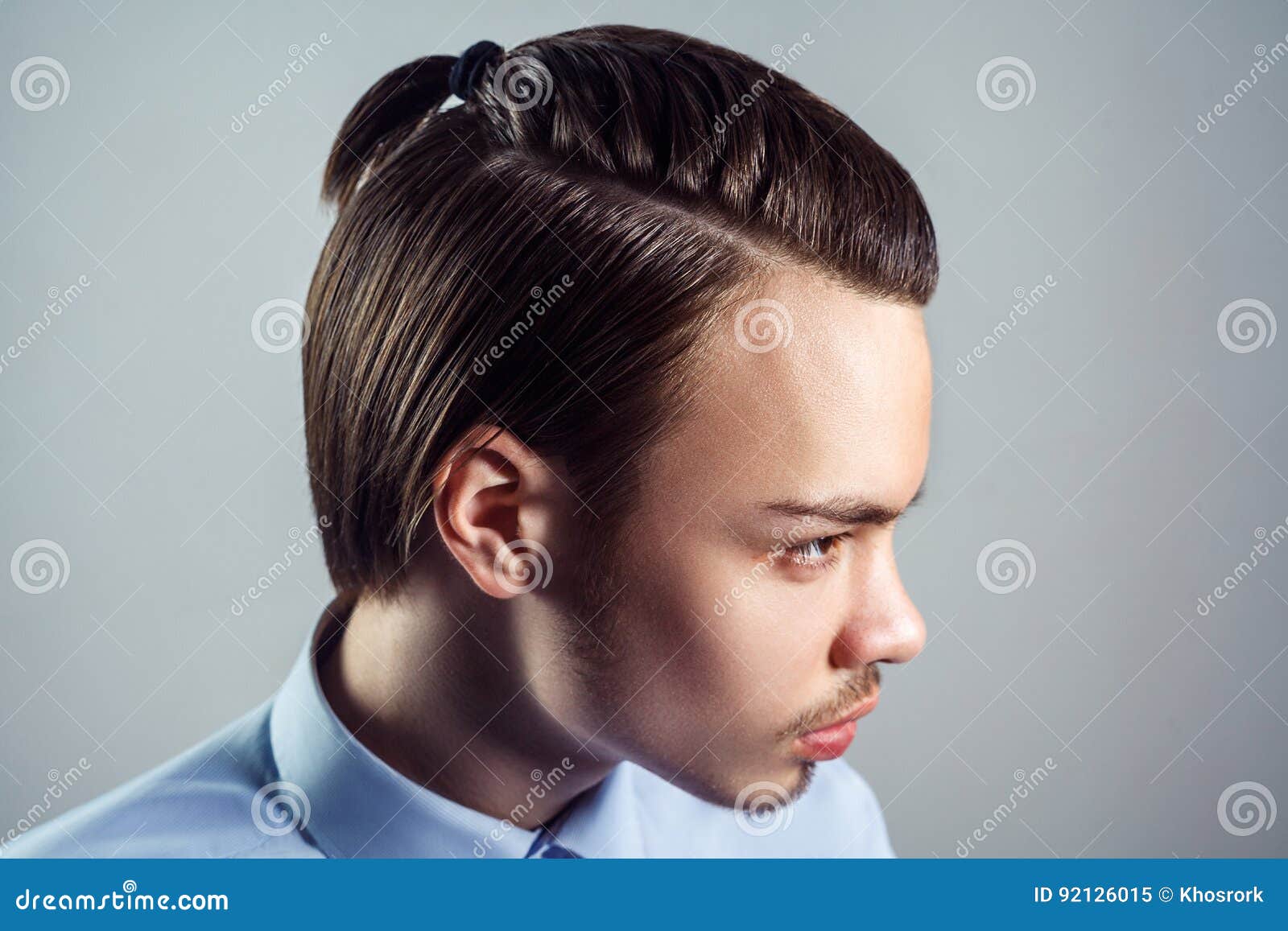 Side View Portrait of Young Man with Top Knot Hairstyle. Stock Image -  Image of face, knot: 92126015