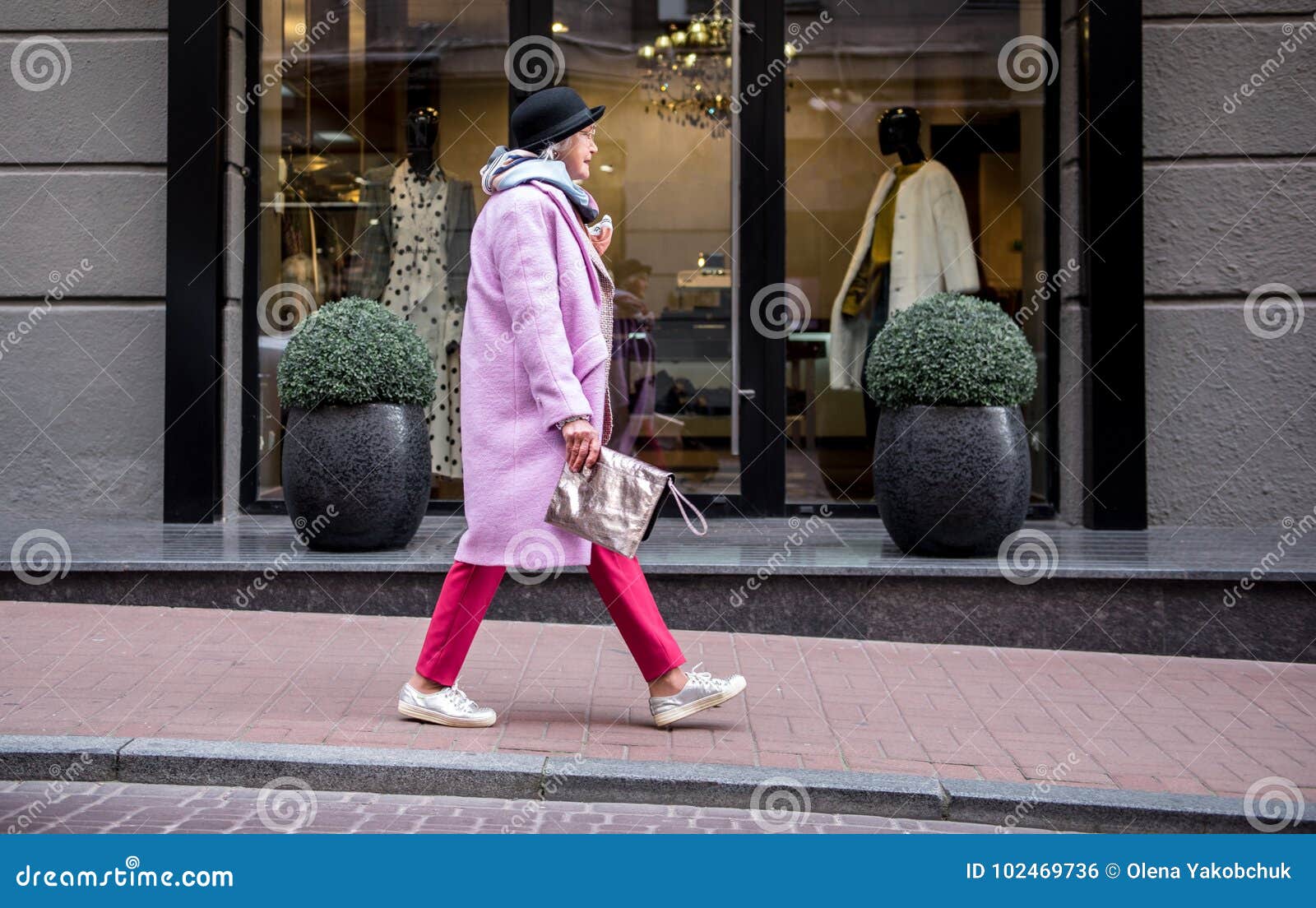 old woman walking side view