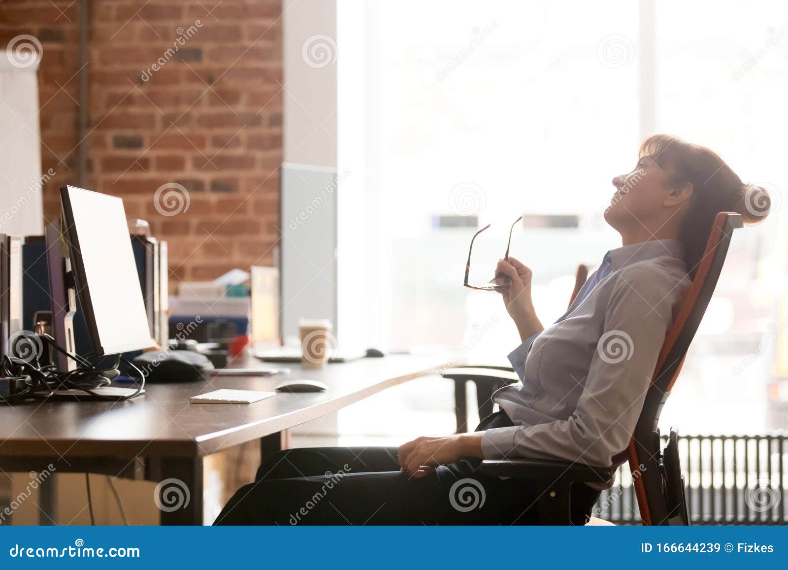 side view relaxed businesswoman resting leaning on comfortable office chair