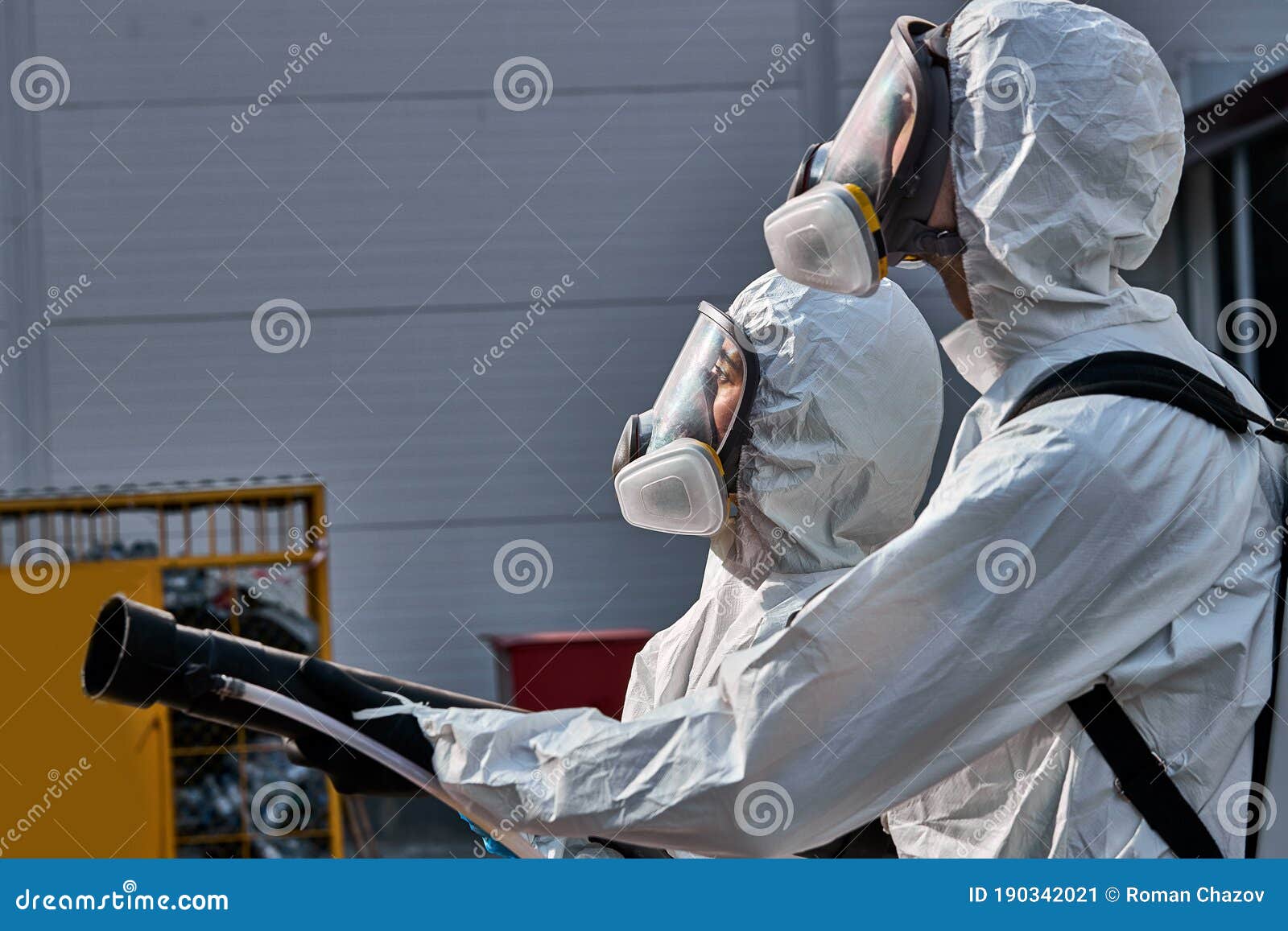 Sanitation Service Worker Disinfecting Public Space With Disinfectant