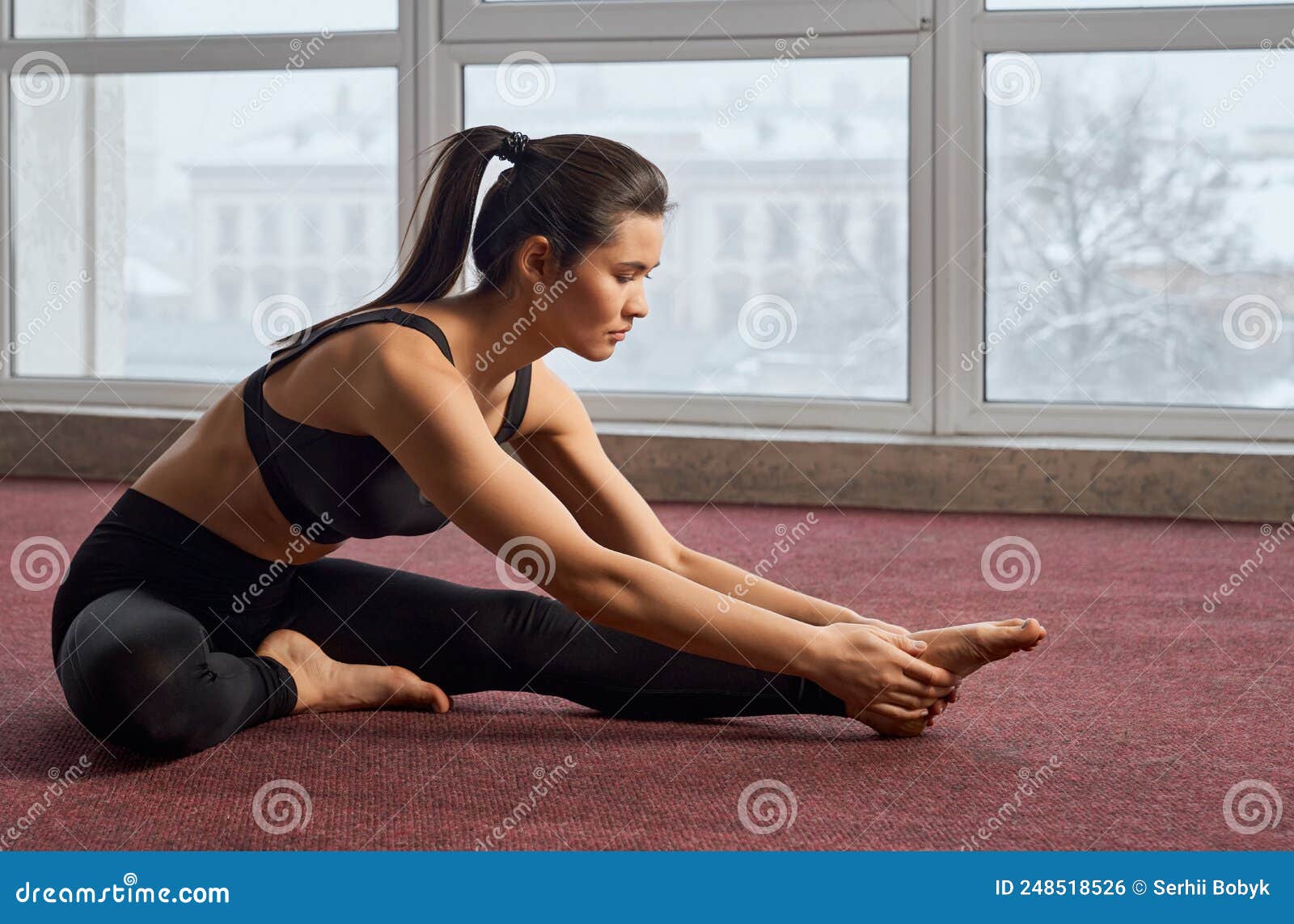 Yoga: Forward fold hands under feet stretch