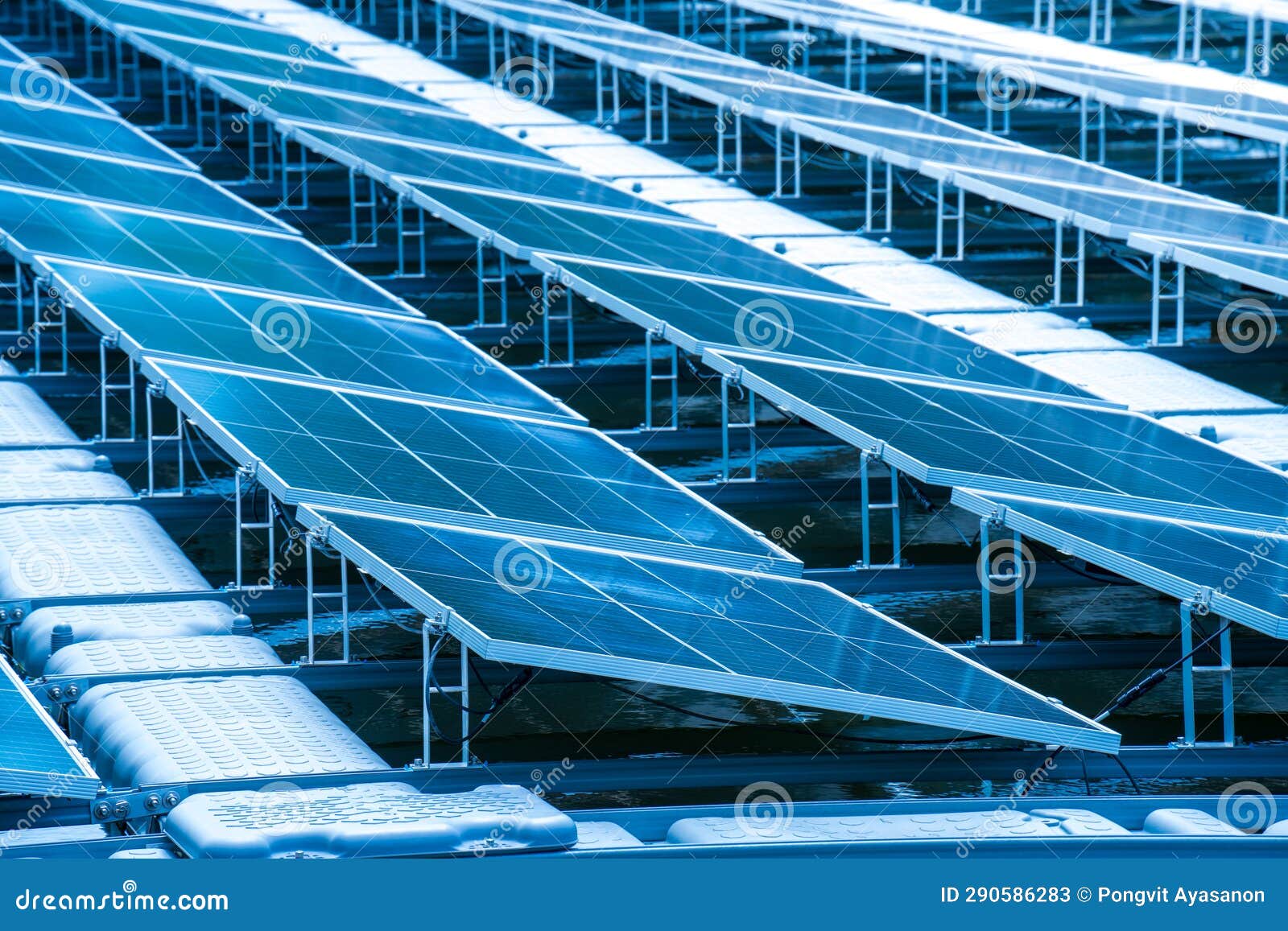 side view of solar panels floating on water in a lake, for generating electricity from sunlight, selective focus, soft focus