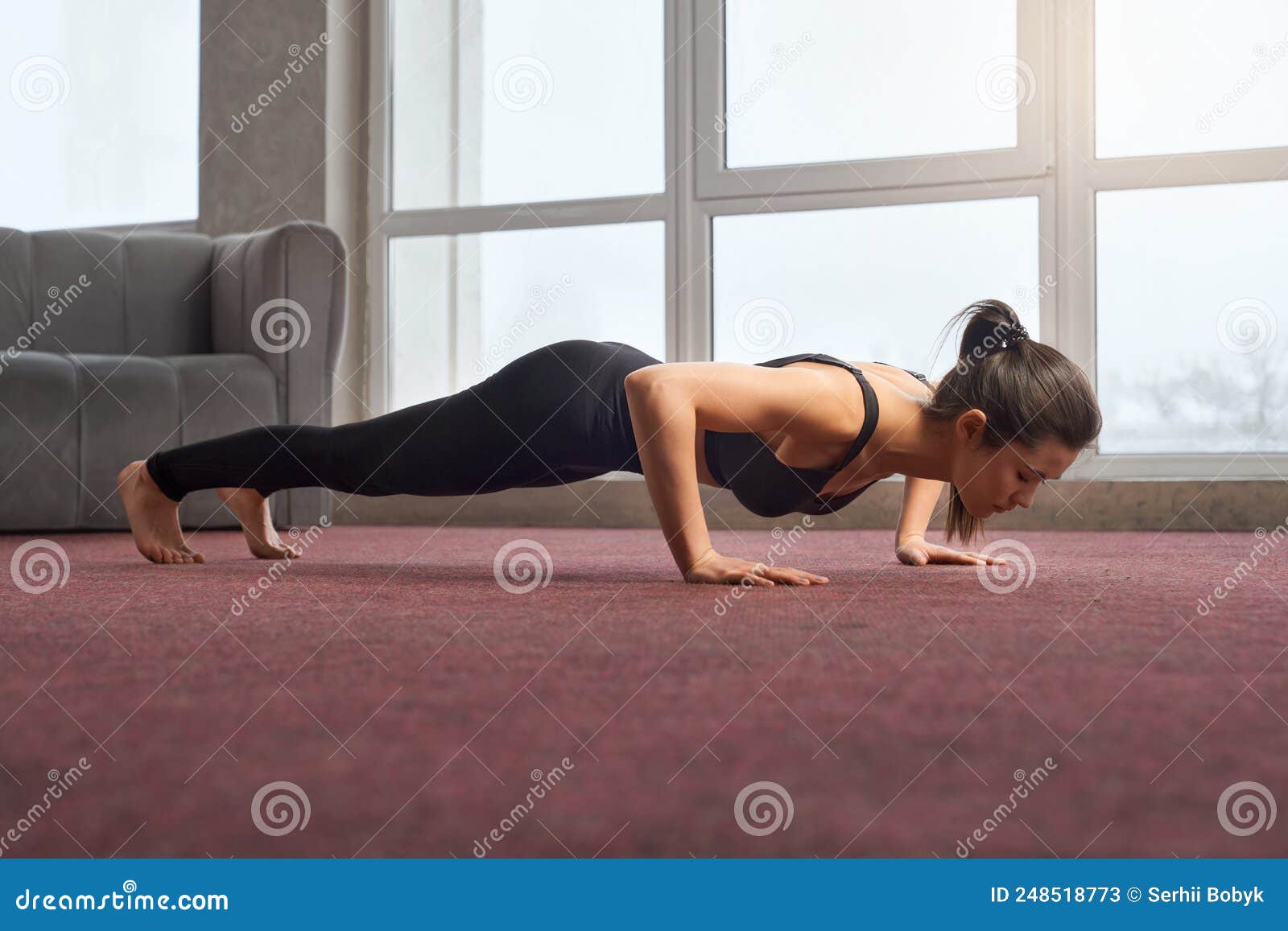 Young beautiful yoga female posing on a studio background. Standing in pose  of an inverted staff, Dvipada Viparita Dundasana. Healthy and active lifes  Stock Photo - Alamy