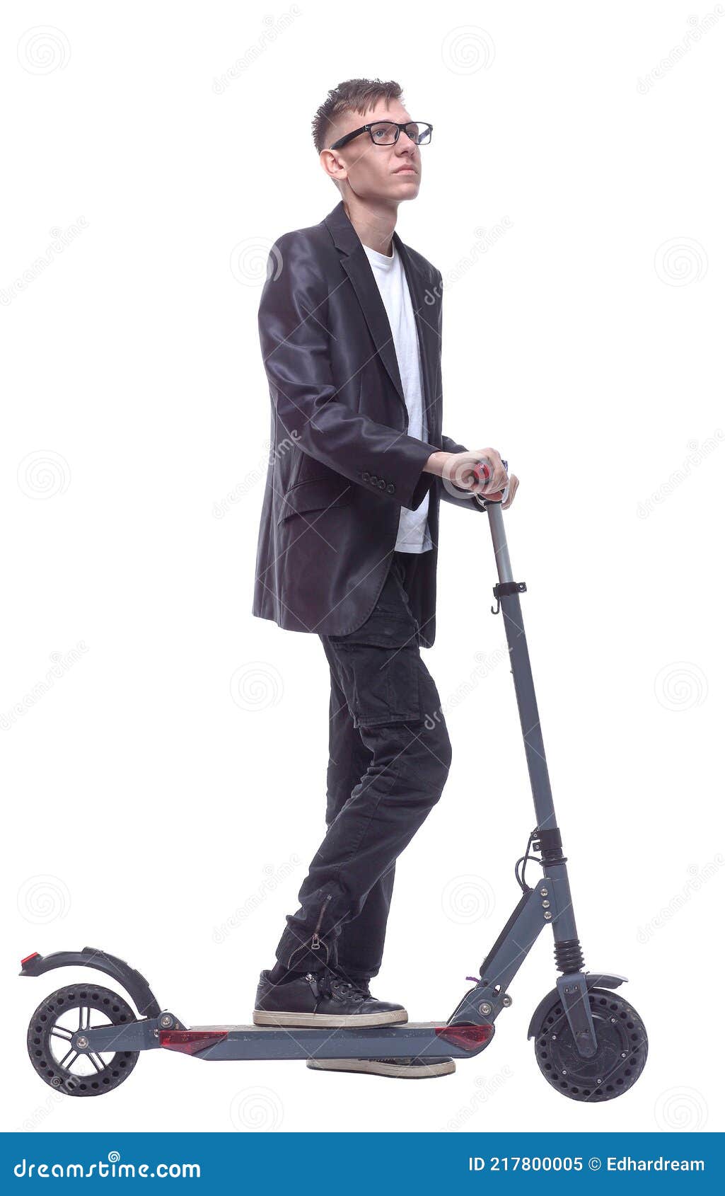 Side View. Student Guy with an Electric Scooter Looking at You Stock