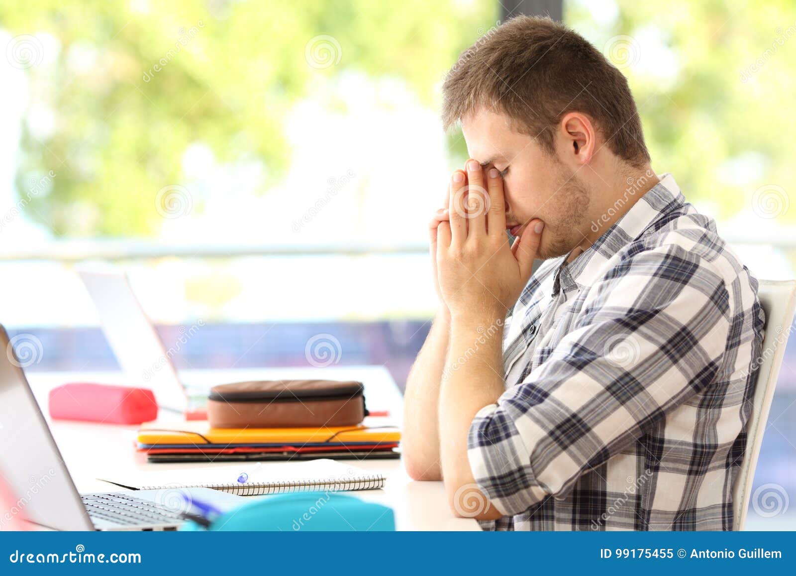 tired student alone in a classroom