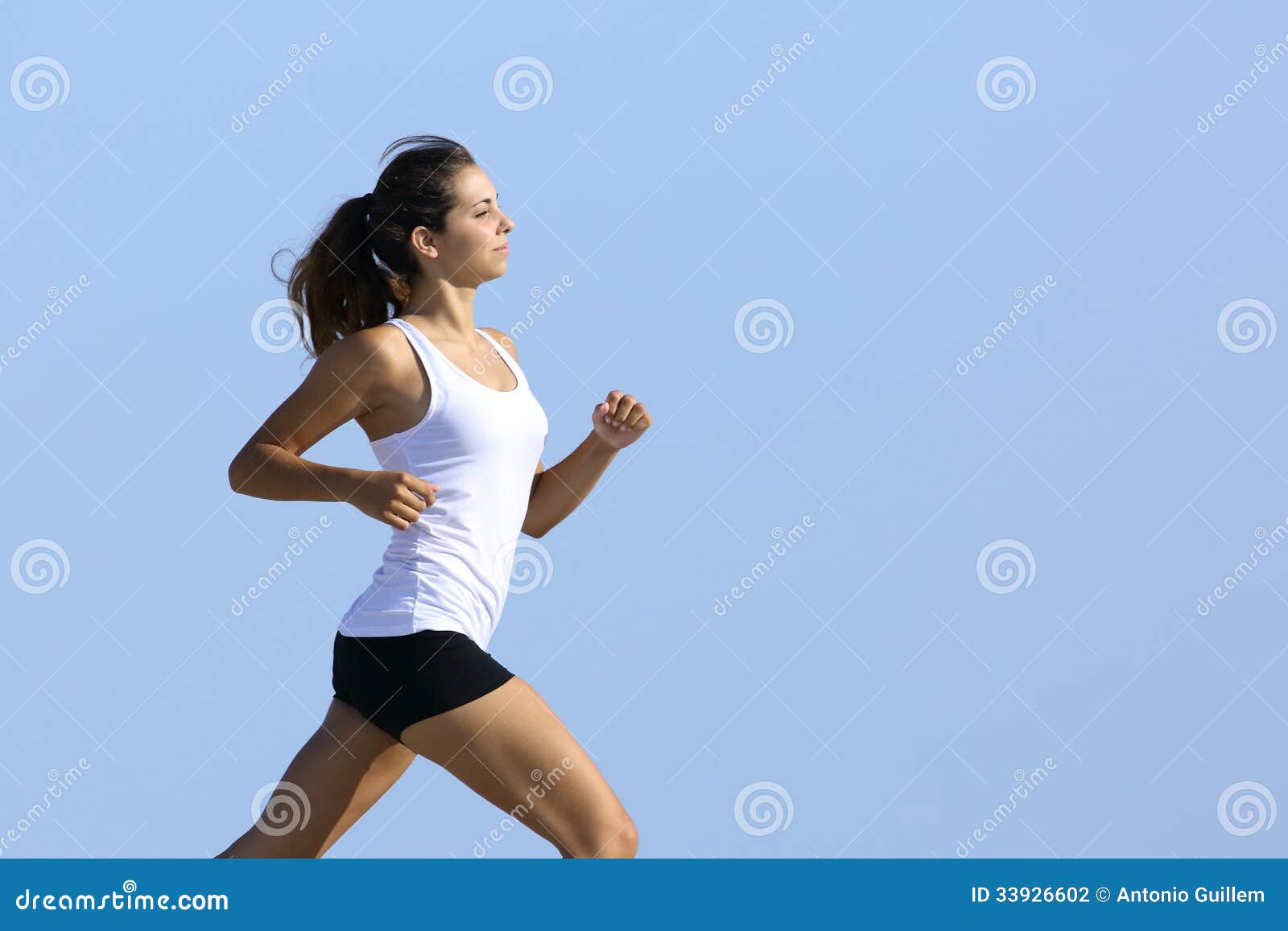 Side view of a woman running stock photo