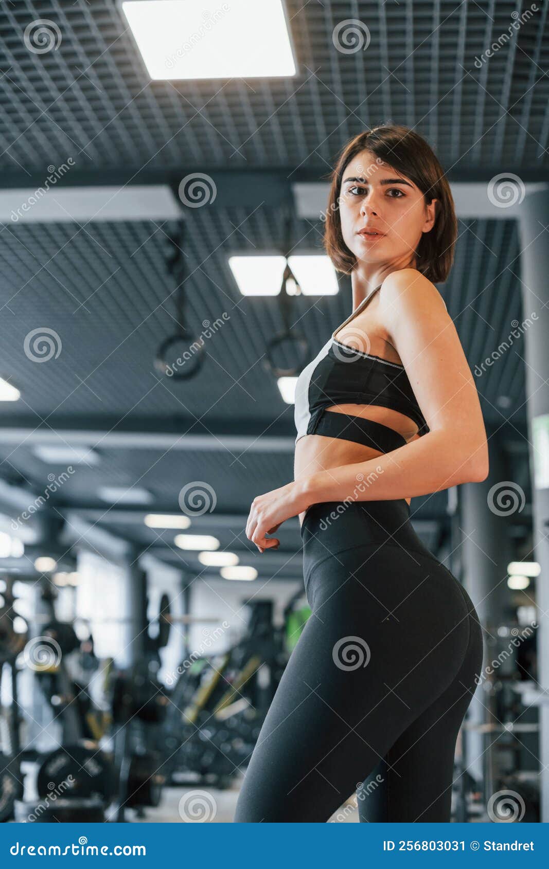 Side View. Woman in Sportive Clothes with Slim Body Type is in the