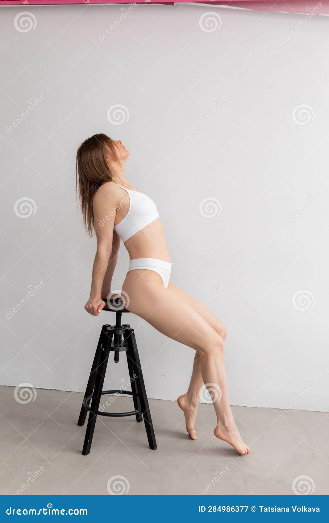 Side View of Young Beautiful Woman Wearing White Underwear Bra, Thongs,  Sitting on Black Stool, Holding Top of Stool. Stock Image - Image of  figure, attractive: 284986377