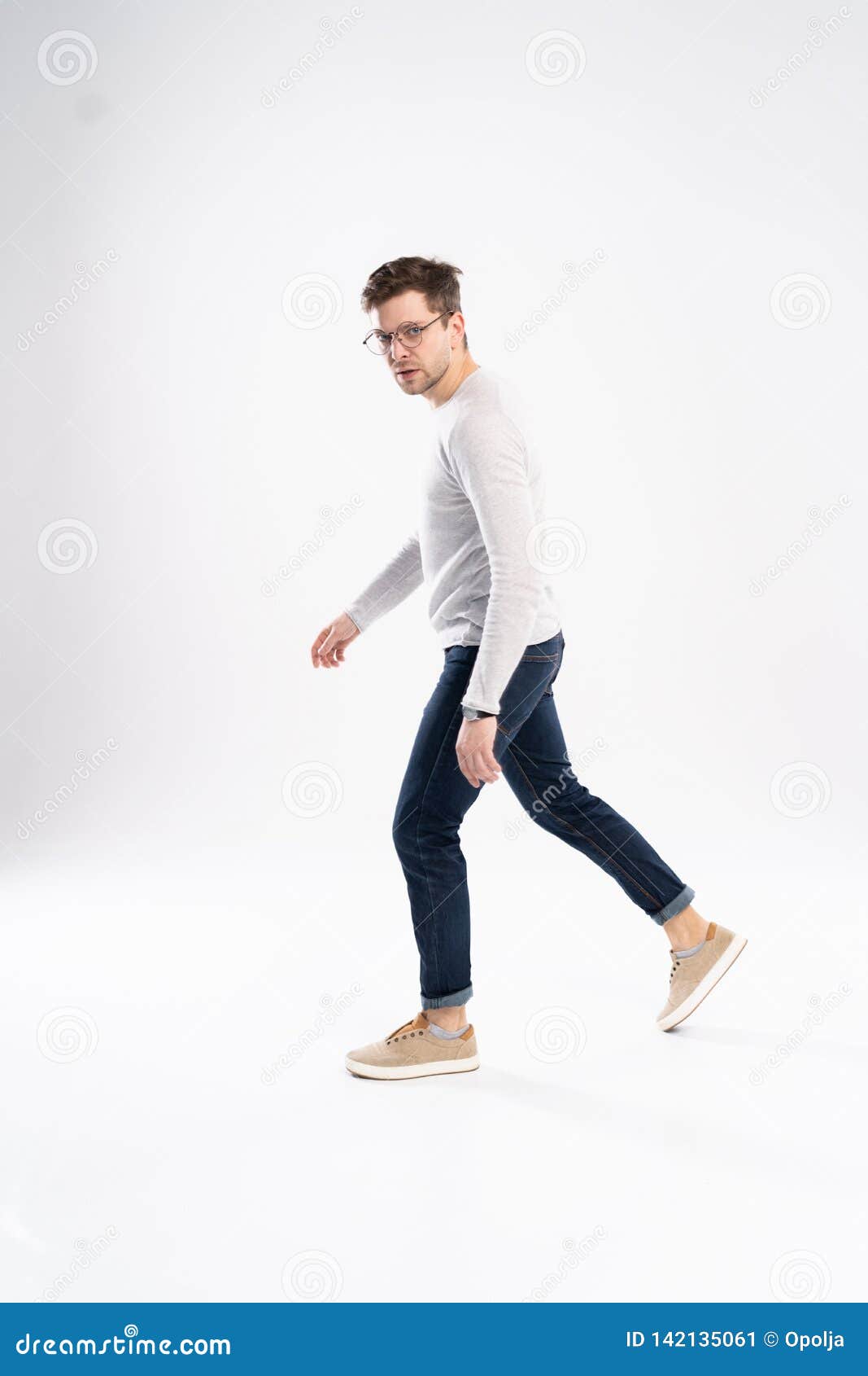 Side View of a Young Fashion Man Walking on Isolated Background. Stock ...