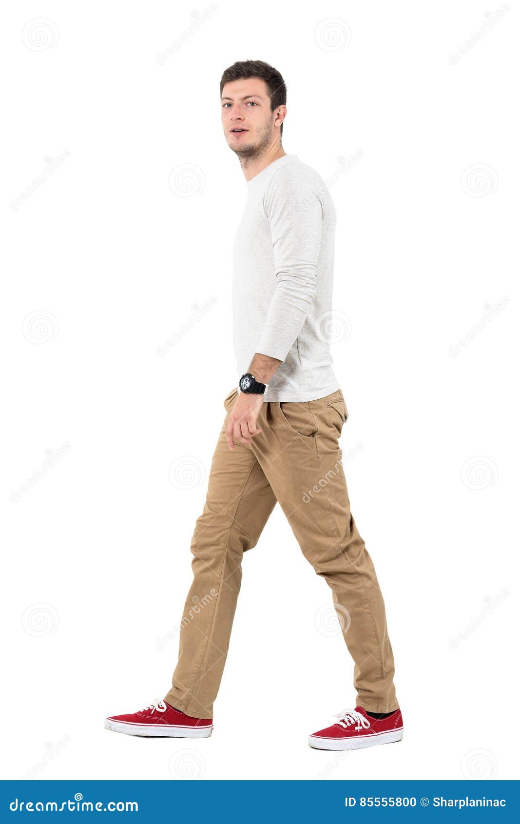 Side View of Young Modern Stylish Man Walking and Looking at Camera ...