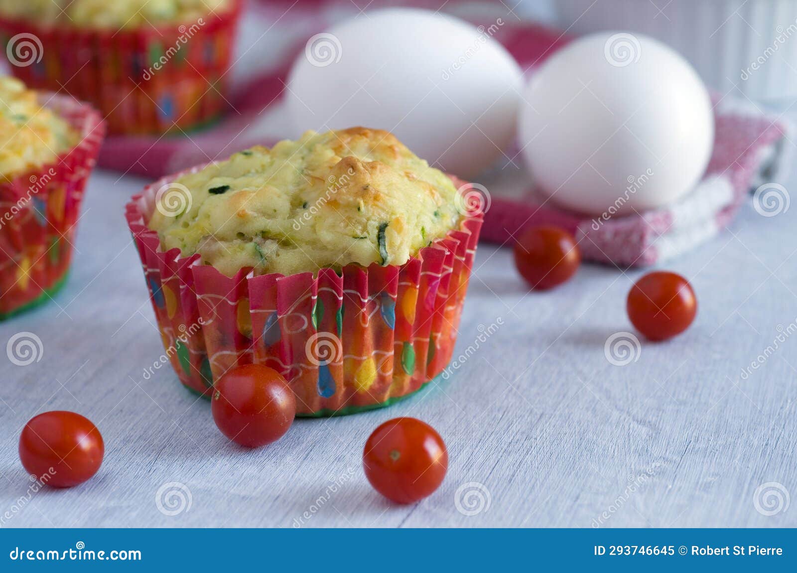 side view of zucchini muffins in flutted red baking cups