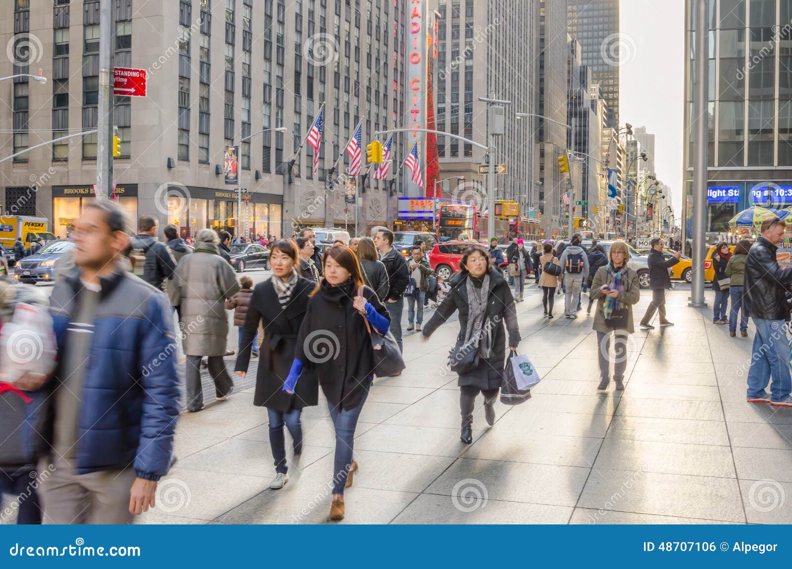 New York City Manhattan Sidewalk On 6th Avenue And Woman Carrying