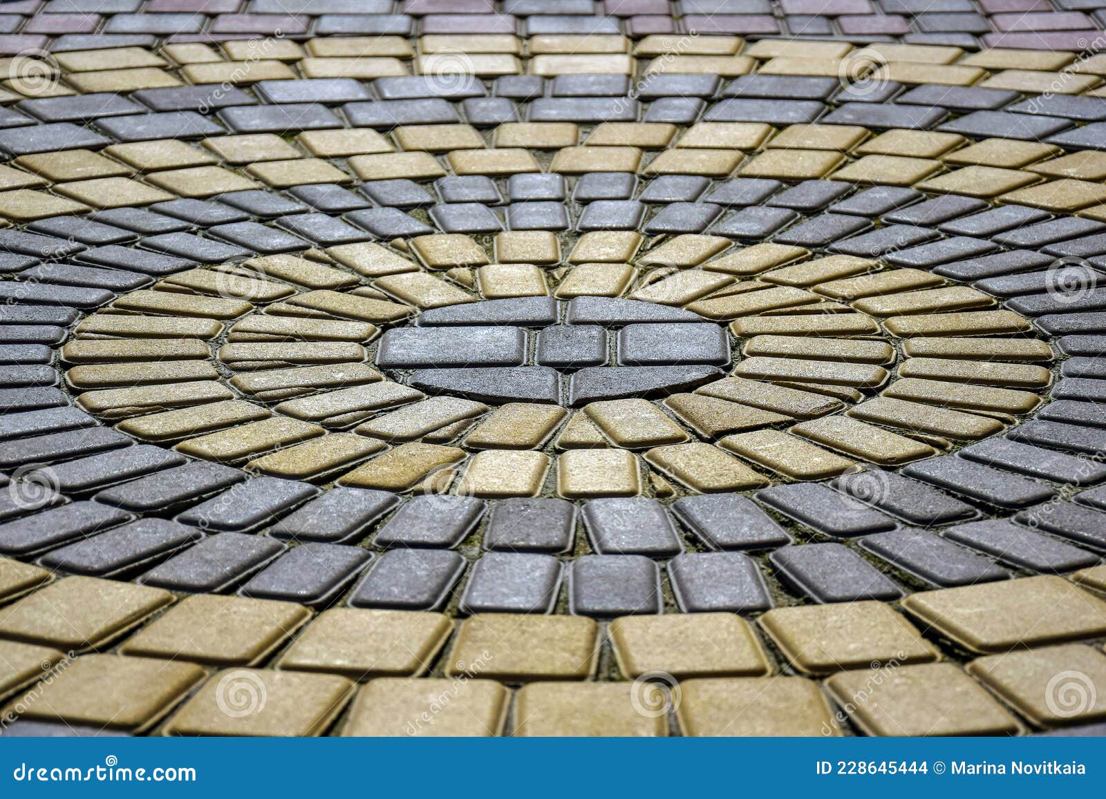 Sidewalk Made of Twotone Paving Slabs. Pattern of Concentric Circles