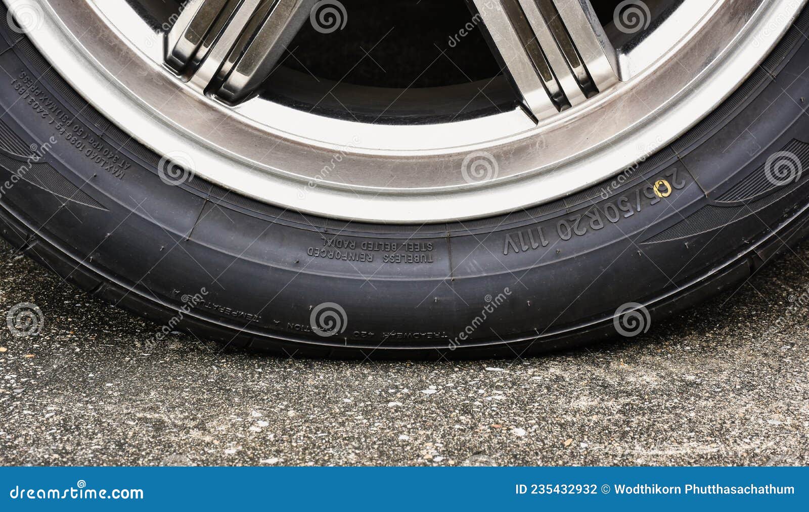 sidewall of the  car tire with a low tire pressure