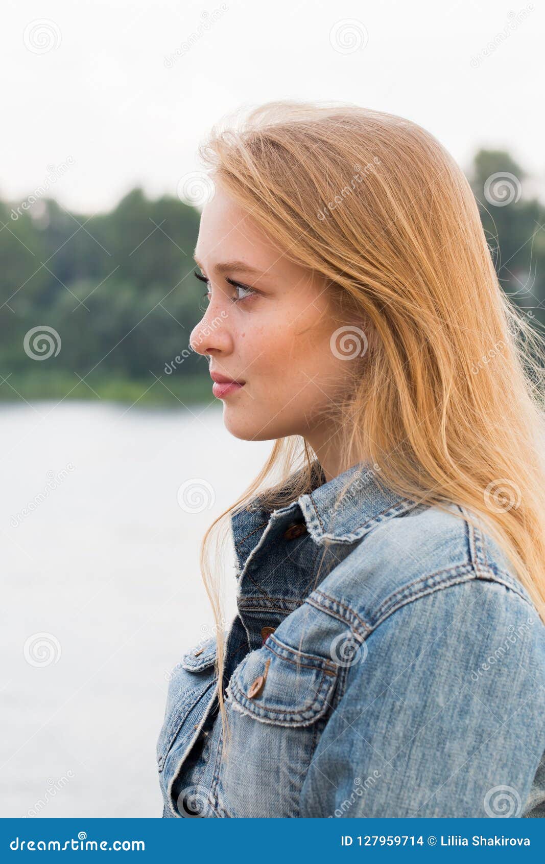 Sideways Close Up Portrait of Beautiful Young Blonde Woman Stock Photo ...