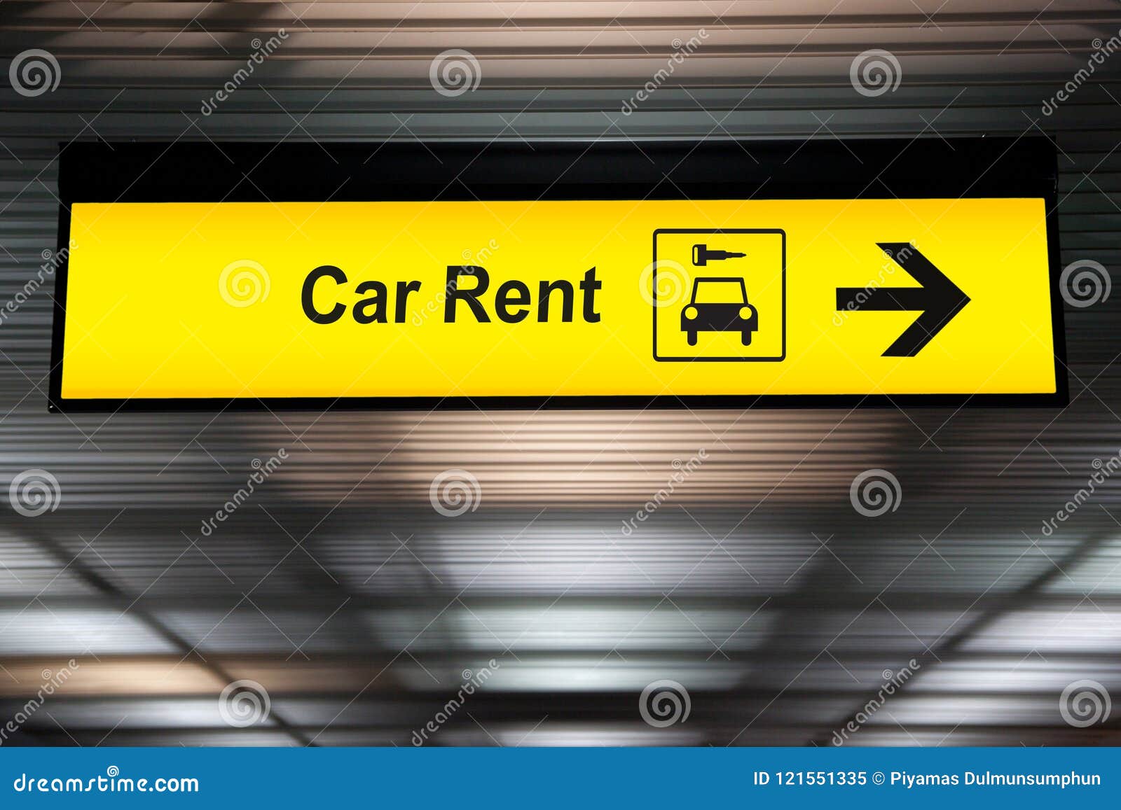 sign with arrow point to rent a car service at the airport