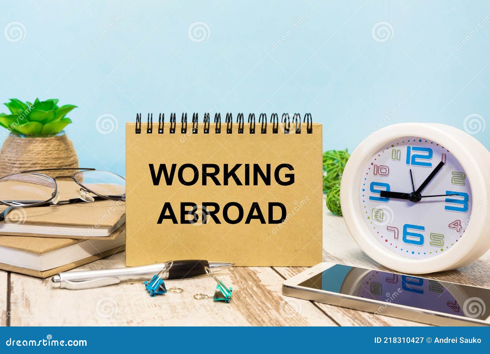 A Sign with the Inscription Working Abroad on the Table Stock Image