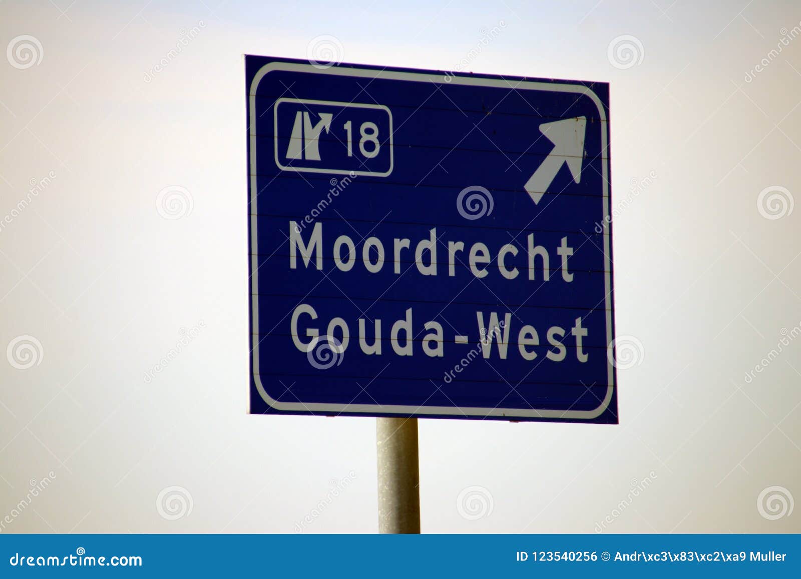 sign at the motorway for a junction in the netherlands to the towns gouda and moordrecht along a20