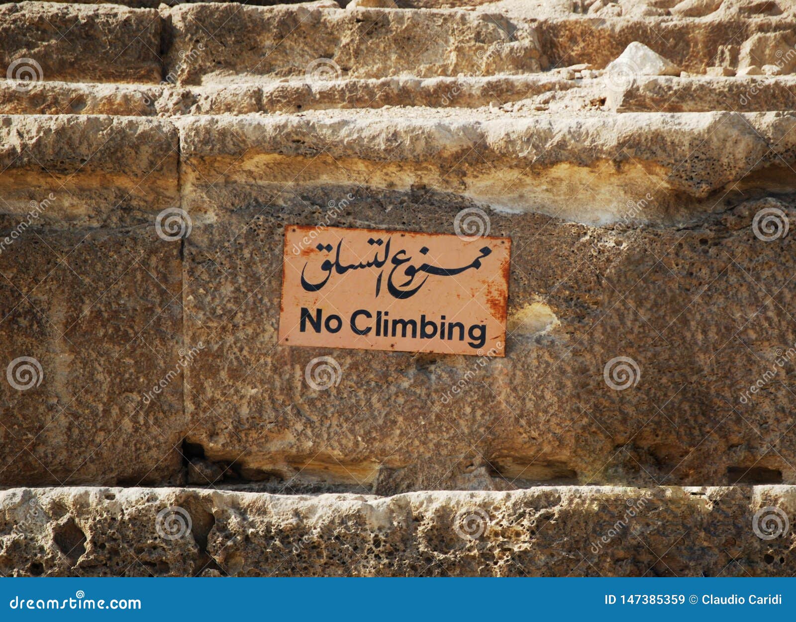 Sign of No Climbing at the Base of the Great Pyramid of Cheops in Cairo
