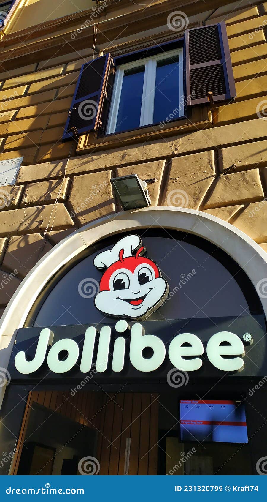 Sign Of A Roman Branch Of The Jollibee Fast Food Chain Filipino