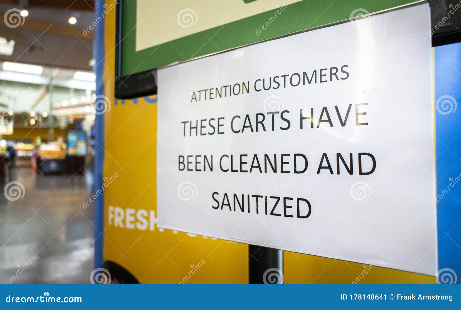 Sign at Store Stating Carts Have Been Cleaned and Sanitized Stock Image