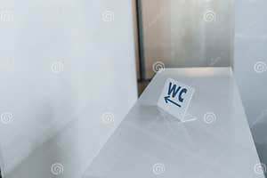 Sign With WC Words On It Showing Direction To The Toilet Indoors Stock Sign With WC Words On It Showing Direction To The Toilet Indoors Stock