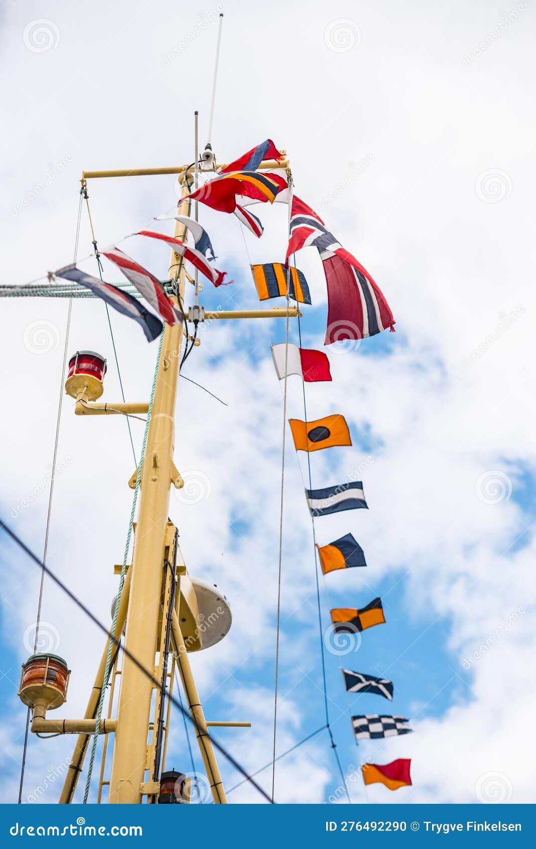 Signal Flag Flying from a Yellow Ship Mast.. Stock Photo Image of